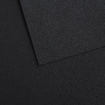 Close-up of a dark charcoal textured surface with overlapping panels creating diagonal edges.