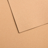 Close-up of two beige textured cardboard sheets overlapping, showing rough surfaces.