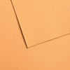 Orange textured paper background with overlapping sheets creating subtle shadows at diagonal angles.