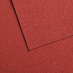 Close-up of red textured panels overlapping with a diagonal seam between them.