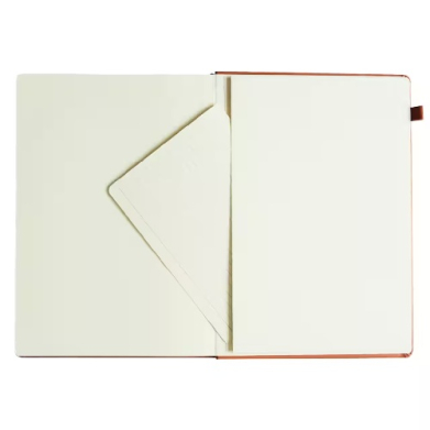 Open notebook with cream pages; left page has a diagonal corner pocket, right page blank, red cover edges visible.