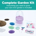 Banner for a Complete Garden Kit: includes seed packets, colorful soil powders, mini tools, and a clear dome showing an all-in-one kit.