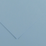 Close-up of light blue paper with two overlapping sheets forming a corner fold and soft shadows.