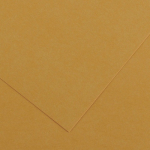 Close-up of overlapping tan kraft paper sheets with a folded corner.