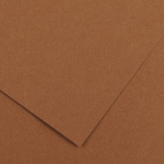 Overlapping sheets of brown cardboard viewed from above, showing textured surface and edges.