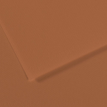 Close-up of orange textured paper with a diagonal fold and subtle grainy surface.