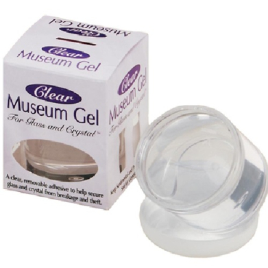 Box labeled 'Clear Museum Gel' with a clear gel jar beside it, used to secure glass and crystal items.
