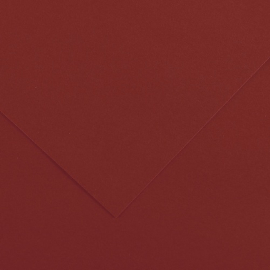 Close-up of red-brown textured paper with a diagonal fold line forming a corner.