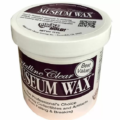 Container of Best Value Museum Wax with burgundy label readout; used to secure collectibles from tipping or breaking in displays or storage.